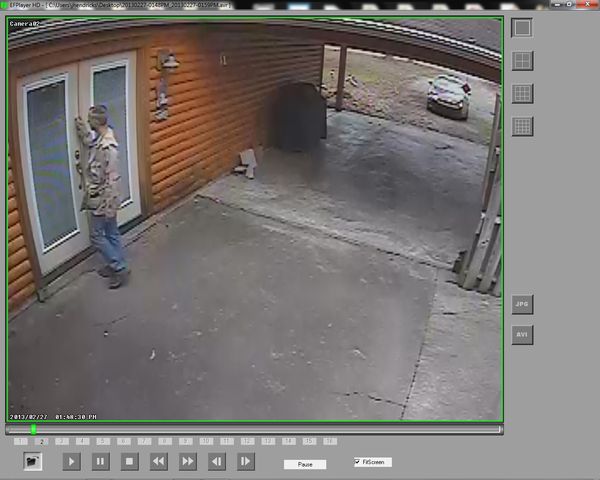 Security footage of a man knocking on a door.