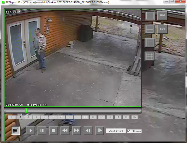 Security footage of a man staring at a door.