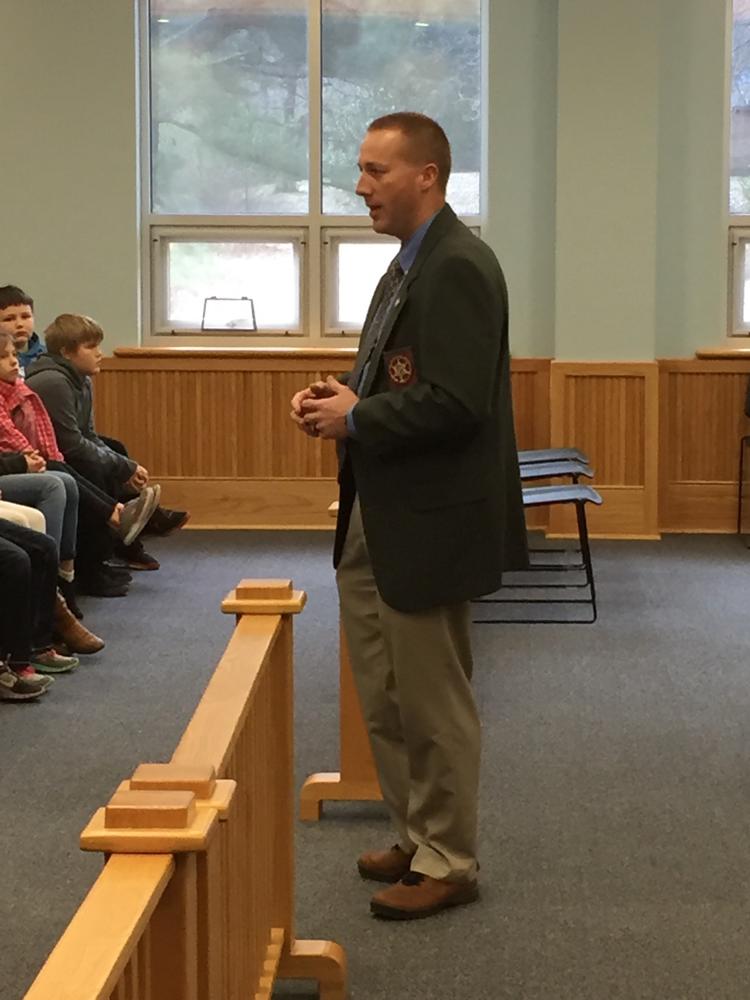 Sheriff Chris Brown talking to the Heber Springs fourth grade class about the different branches of government.