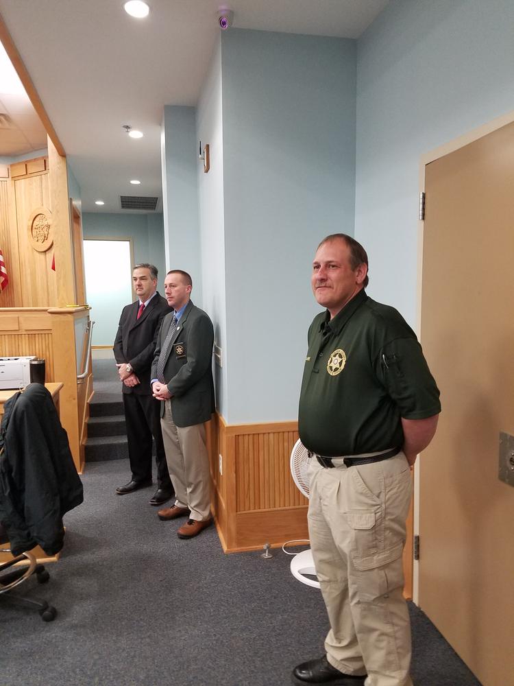 Judge Lee Harrod, Sheriff Chris Brown, and another staff member observing the tour.