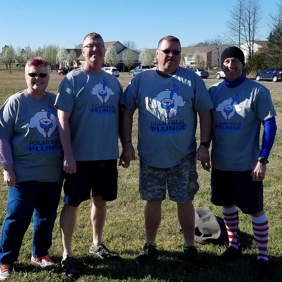 Sheriff Brown and others in their Polar Bear Plunge shirts. 