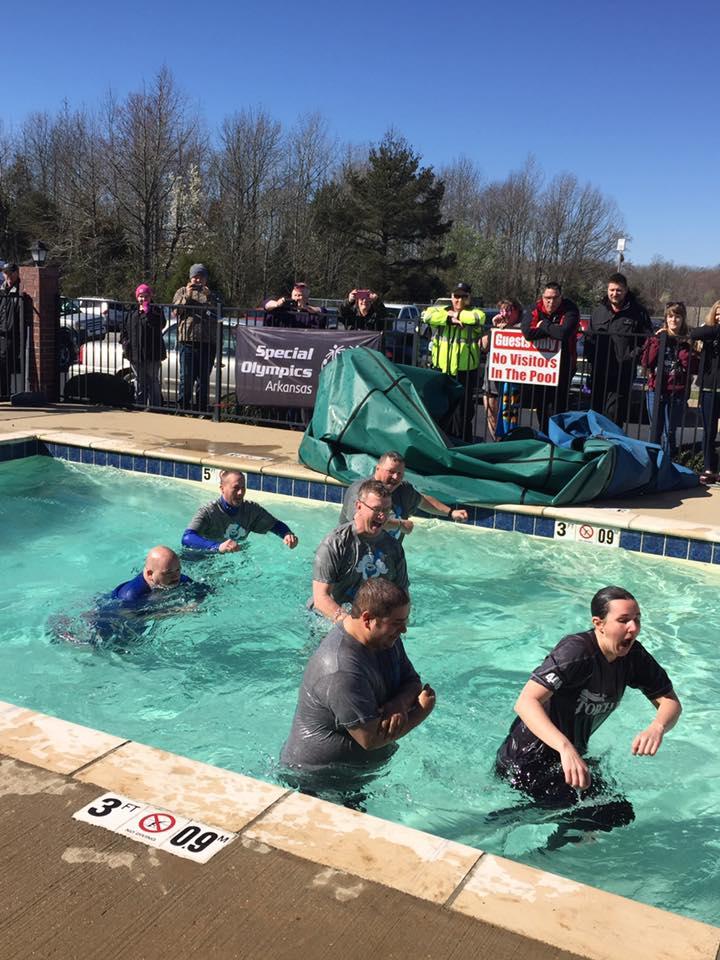 Participants taking the plunge in the cold water.