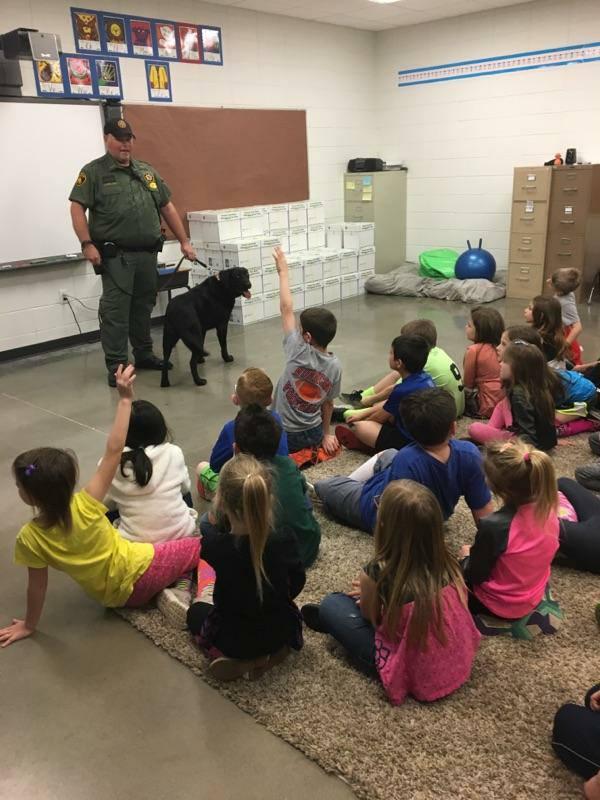 Deputy McLain and K9 Zeke talking to the class. 