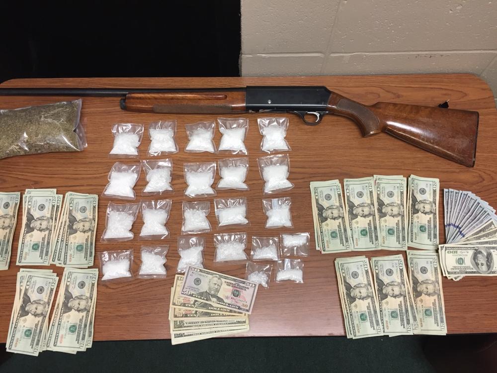 Seized money, drugs, and firearm.