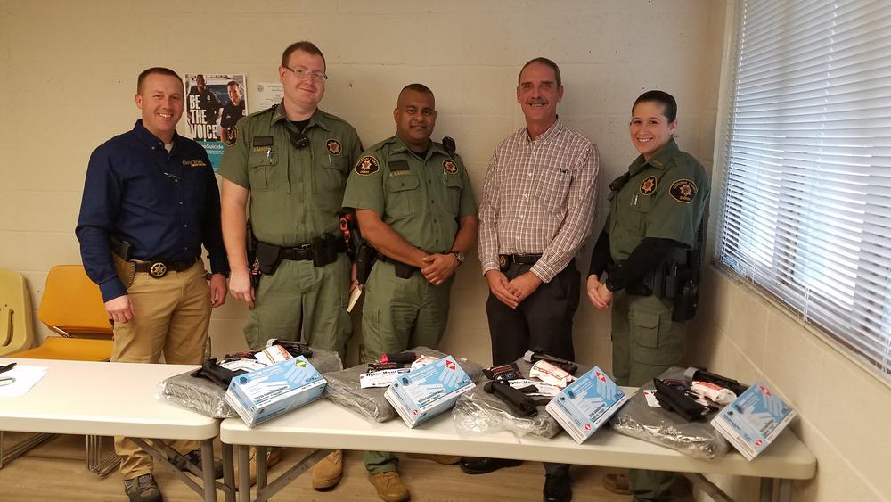 Sheriff Brown and deputies with Individual First Aid Kits.
