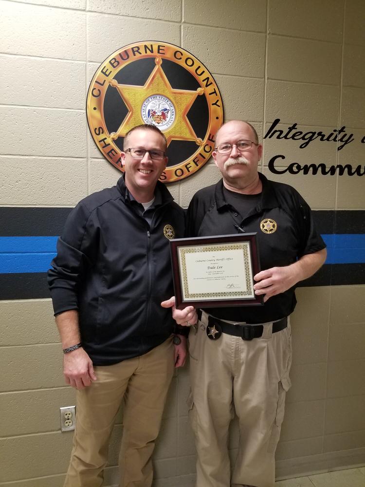 Deputy Dale Lee receiving award from Sheriff Chris Brown.