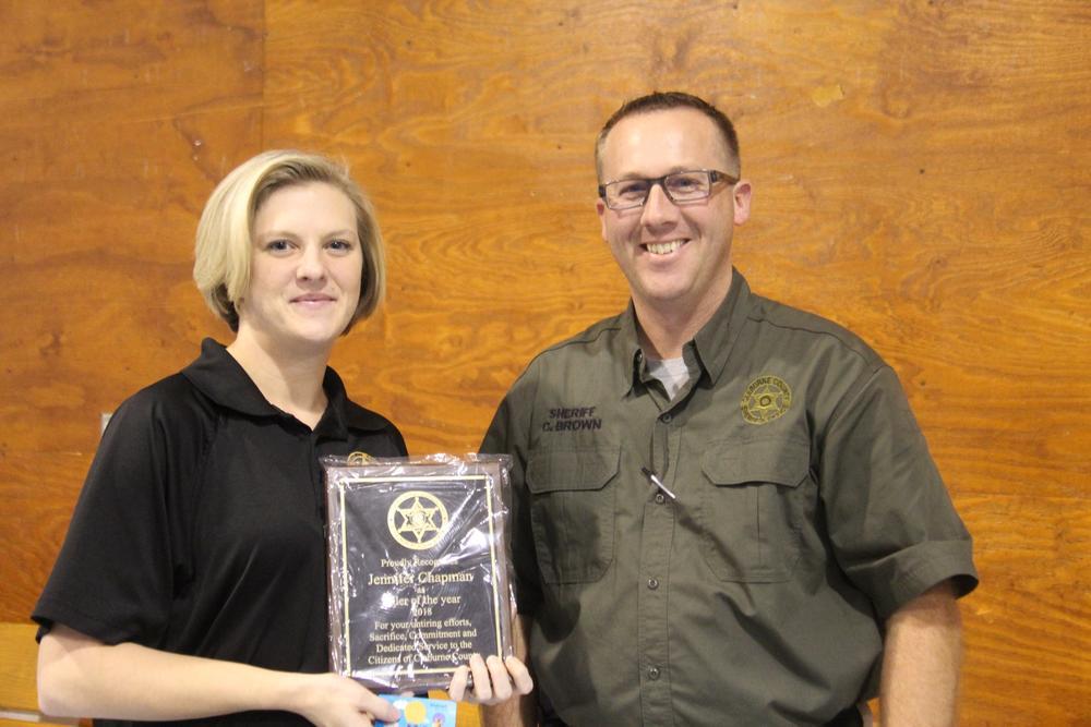 Jennifer Chapman receiving award for Jailer of the Year from Sheriff Chris Brown.