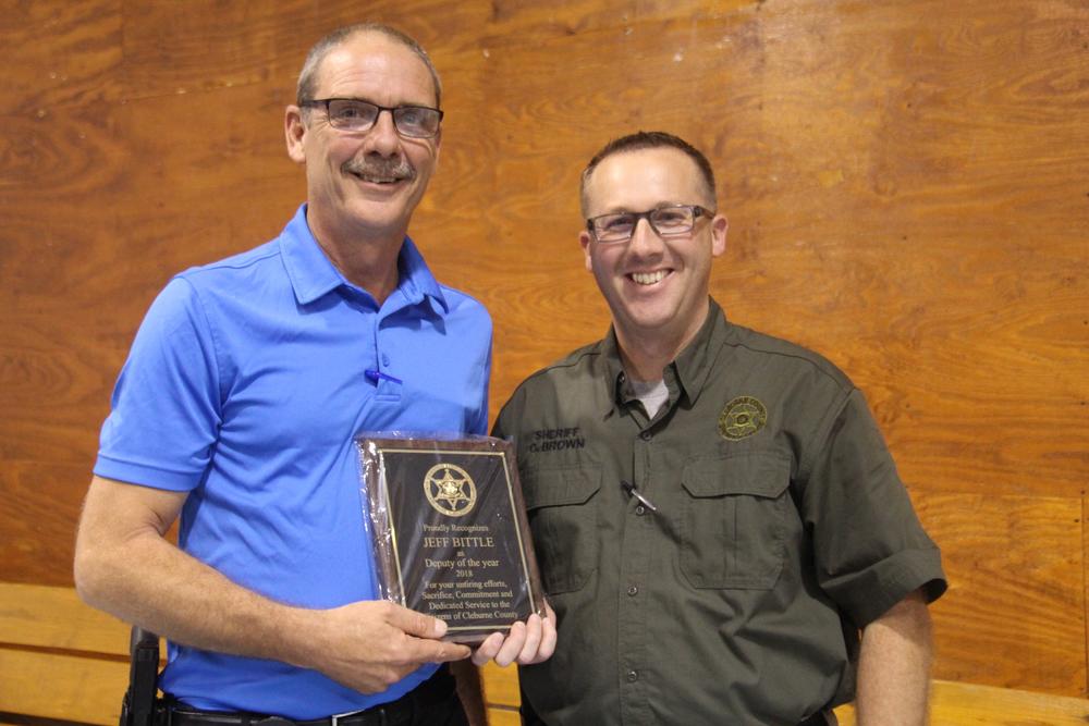 Lieutenant Jeff Bittle receiving award for Deputy of the Year from Sheriff Chris Brown.