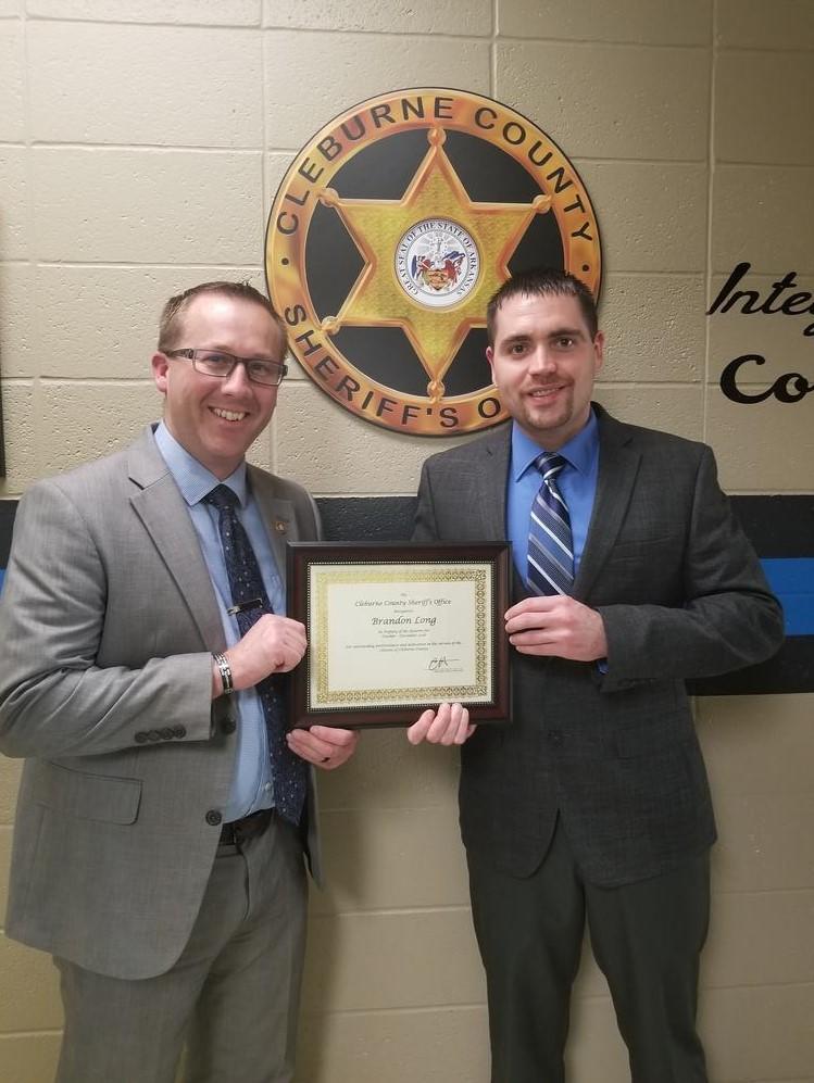 Brandon Long receiving award from Sheriff Brown.