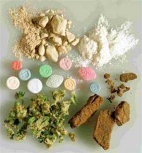 a collection of drugs laid out on a white table