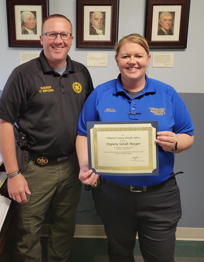 Deputy Sarah Burger receiving award from Sheriff Brown.