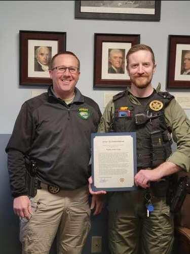 Deputy Trip Receiving award from Sheriff Brown.